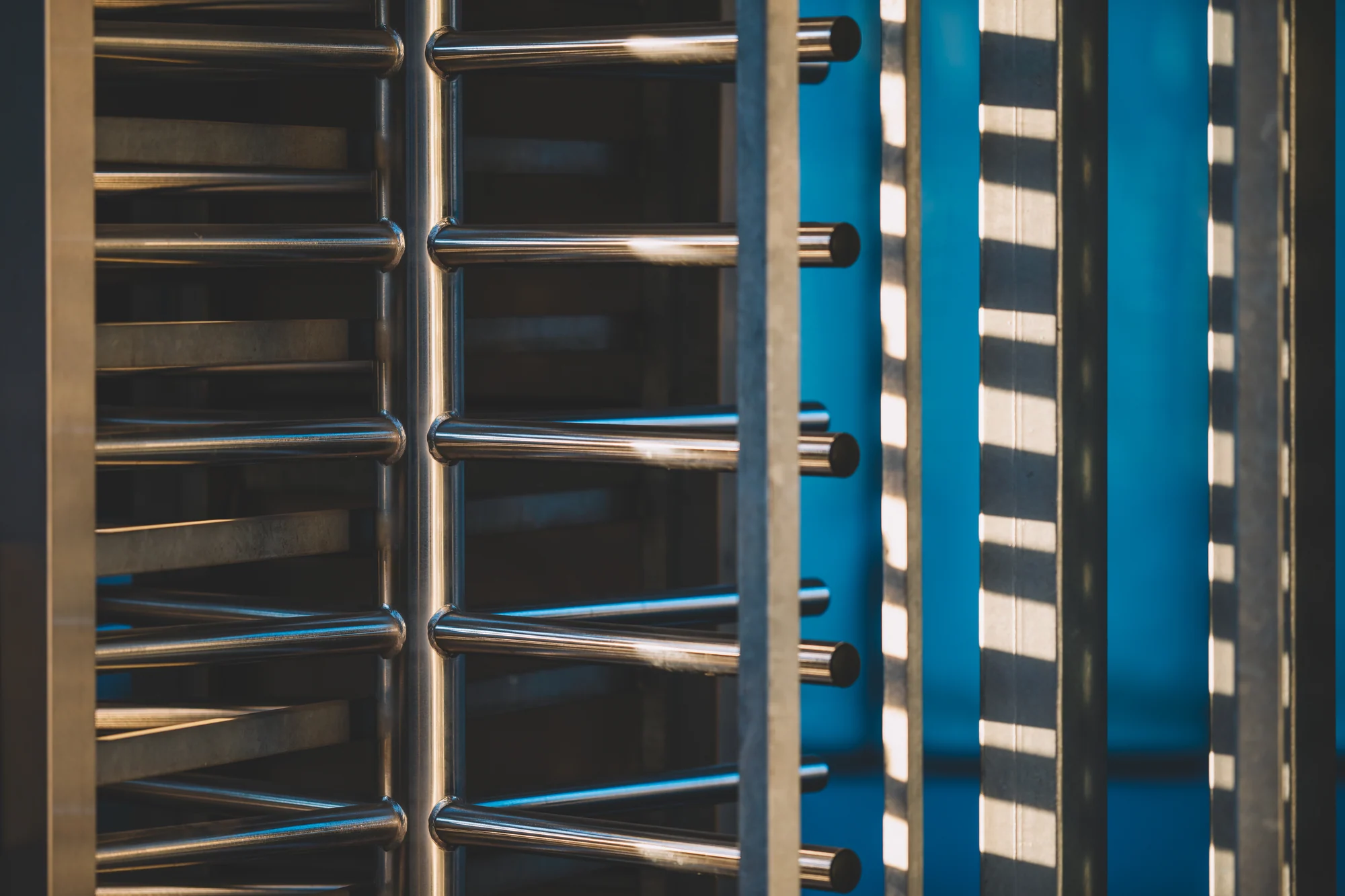 Stainless-steel full-height turnstile at an entrance